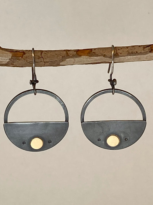 One-of-a-kind hand-crafted earrings. Elegant half-circle fills in the bottom half of a hoop. Dark oxidized sterling silver with 14k gold accents. Hand-stamped embellishments. Handmade ear wires. Style: rustic, boho, elemental, earthy yet elegant