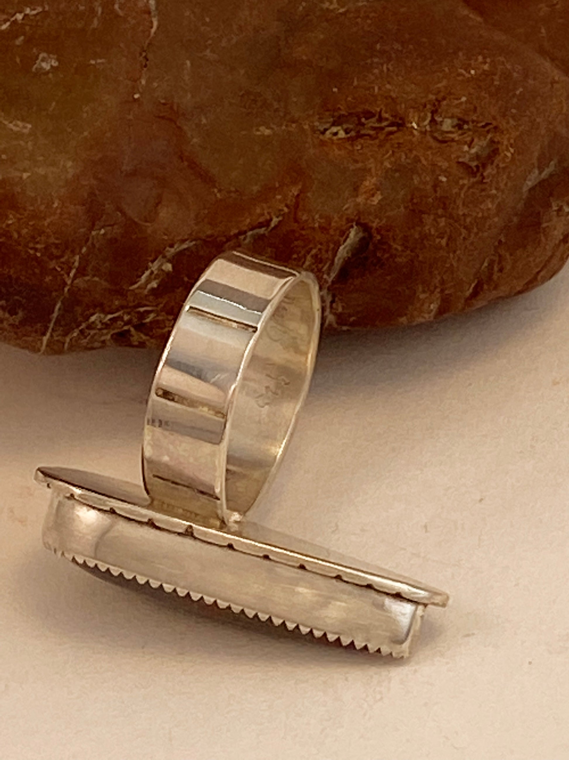 One-of-a-kind hand-crafted ring with chrysocolla stone. Backplate and band are textured with stamped line patterns.