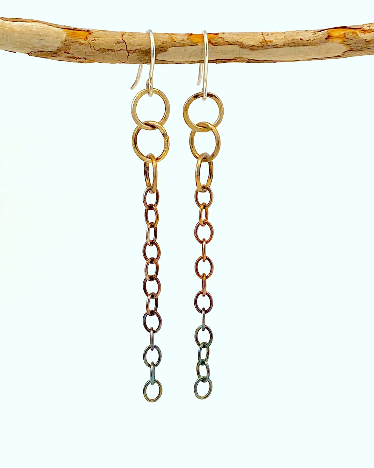 Hand-crafted earrings; unique design. Elegant chain drops from three larger links. Sterling silver oxidized with ombré effect - silver at top, black at bottom. Hung on handmade ear wires. Style: rustic, boho, elemental, earthy yet elegant