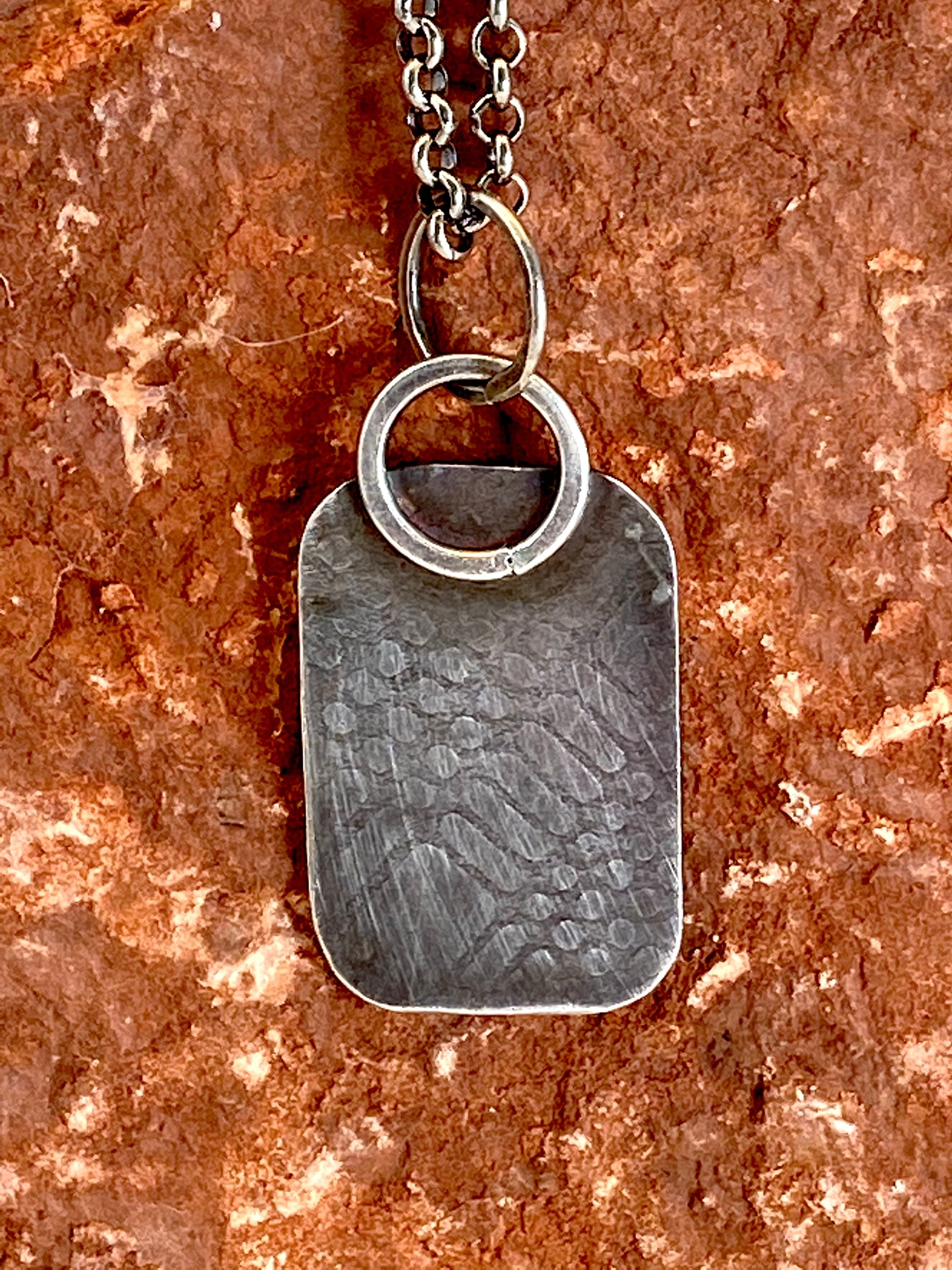 Hand-crafted, one-of-a-kind sterling silver pendant featuring 14k gold star accent and sterling pentacle. 19" sterling silver rolo chain with a handcrafted clasp. 1" x 11/16"