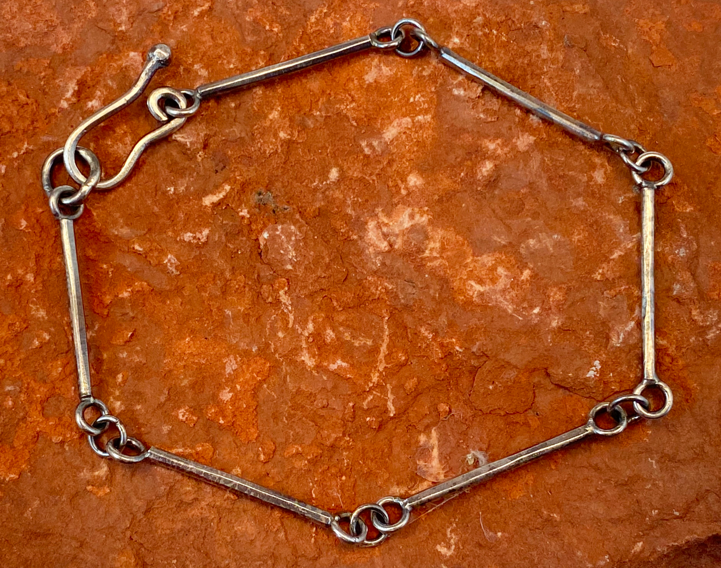 Handmade sterling silver bracelet with stick links.   Handcrafted hook clasp. Runs on the large size, but not oversized.  Style: rustic, boho, funky, organic, earthy, natural