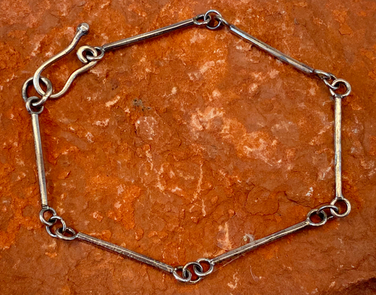 Handmade sterling silver bracelet with stick links.   Handcrafted hook clasp. Runs on the large size, but not oversized.  Style: rustic, boho, funky, organic, earthy, natural