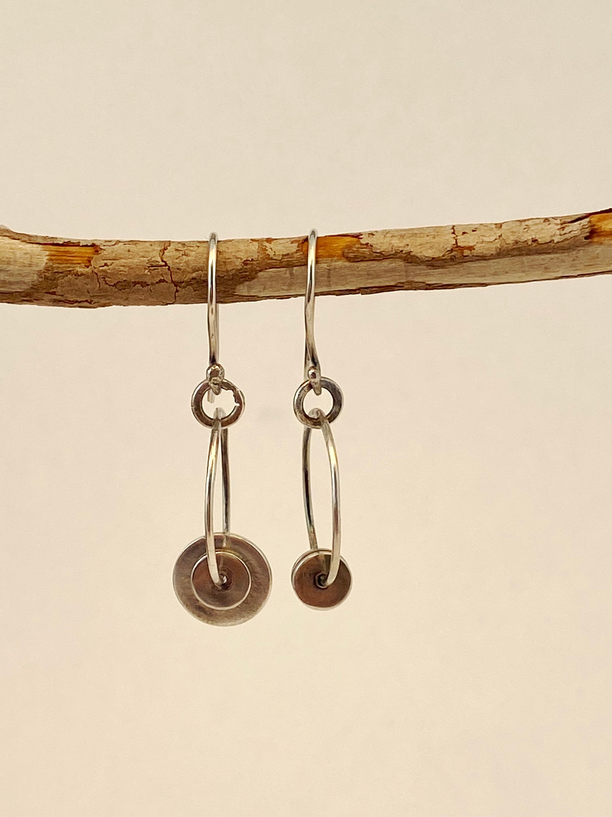 One-of-a-kind hand-crafted hoop earrings with sterling disks and handmade ear wire.  Style: rustic, boho, elemental, earthy yet elegant