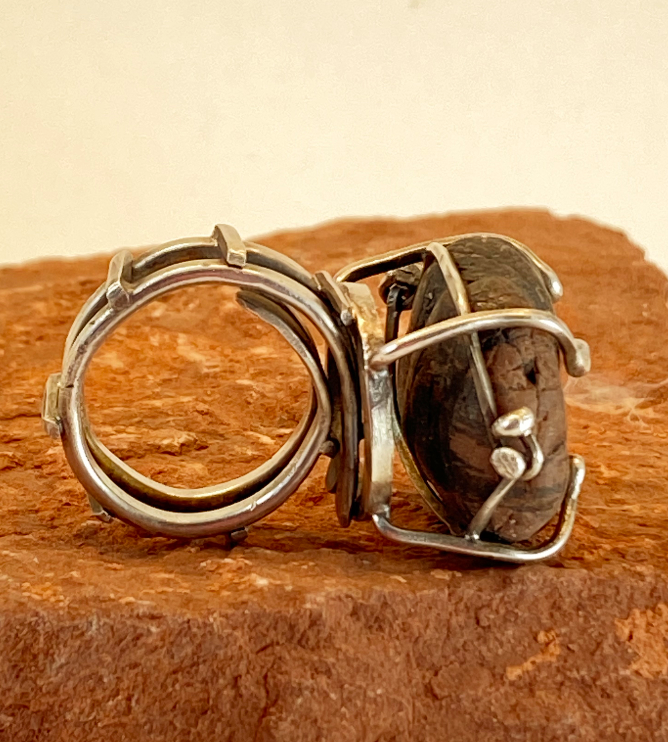 Unique sterling silver raised cage and prong setting for beach stone