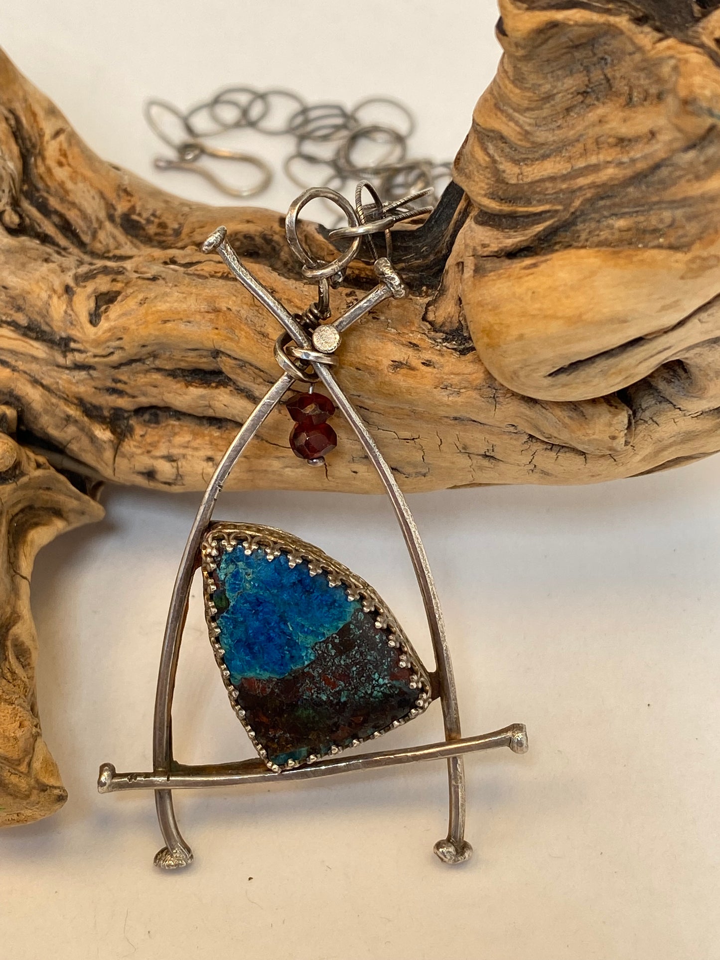 * At the heart of this necklace is beautiful Apache Chrysocolla stone in a fancy bezel surrounded by a sterling silver nail-head frame, reinforced by a sterling backplate. 