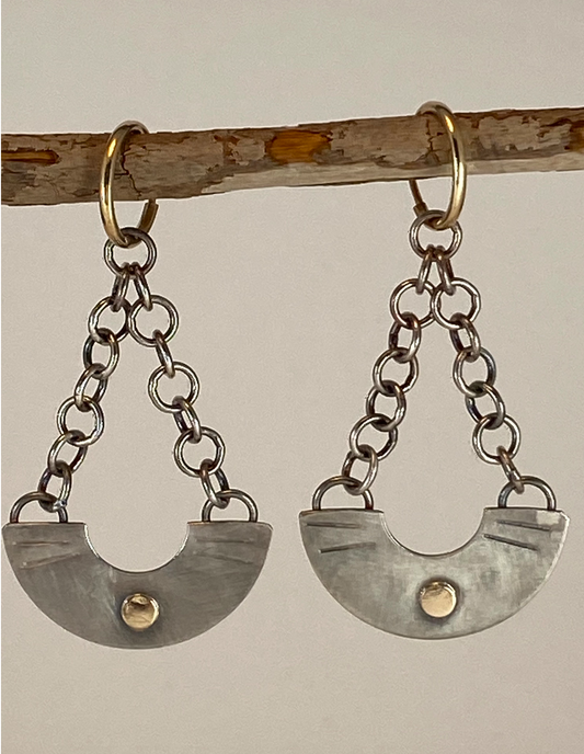 One-of-a-kind hand-crafted earrings.  Elegant half-circle vessel shape sterling silver earrings 14k gold high sheen accents Hand-stamped embellishments Hung with silver chain from small 14k hoops  Style: rustic, boho, elemental, earthy yet elegant