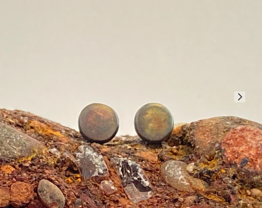 One-of-a-kind hand-crafted sterling silver stud earrings. Colorful, organic patina. 1/4" across, 1/10" thick. Sterling silver posts and back. Style: Organic, Boho, Rustic, Wabi-Sabi, Natural, Funky, Artsy Earthy yet Elegant