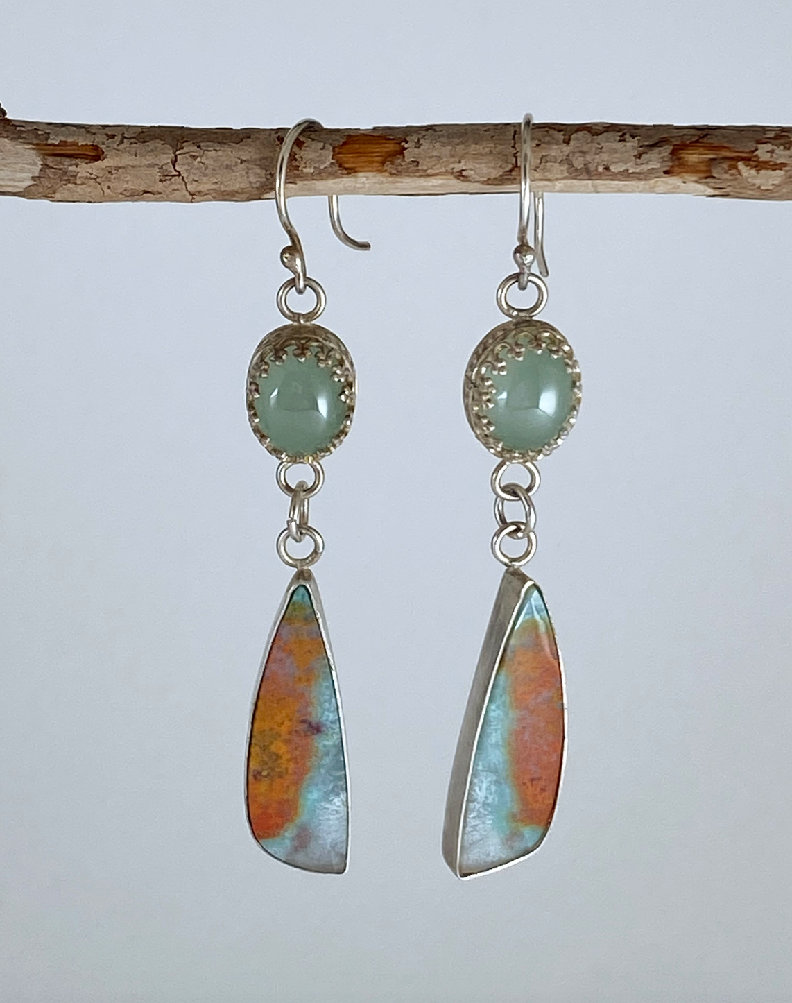 One-of-a-kind hand-crafted earrings. Two headline stones: A gorgeous "sunrise" blue and orange Indonesian opal/petrified wood under stunning green chalcedony; Set on sterling silver, chalcedony in decorative gallery wire bezel Style: rustic, boho, elemental, earthy yet elegant