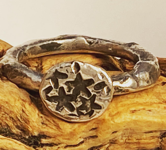 One-of-a-kind hand-crafted ring.  Unique fused sterling silver ring Lone star design stamped on silver "stone" Women's size 5-1/2 Style: rustic, boho, organic, funky, earthy yet elegant