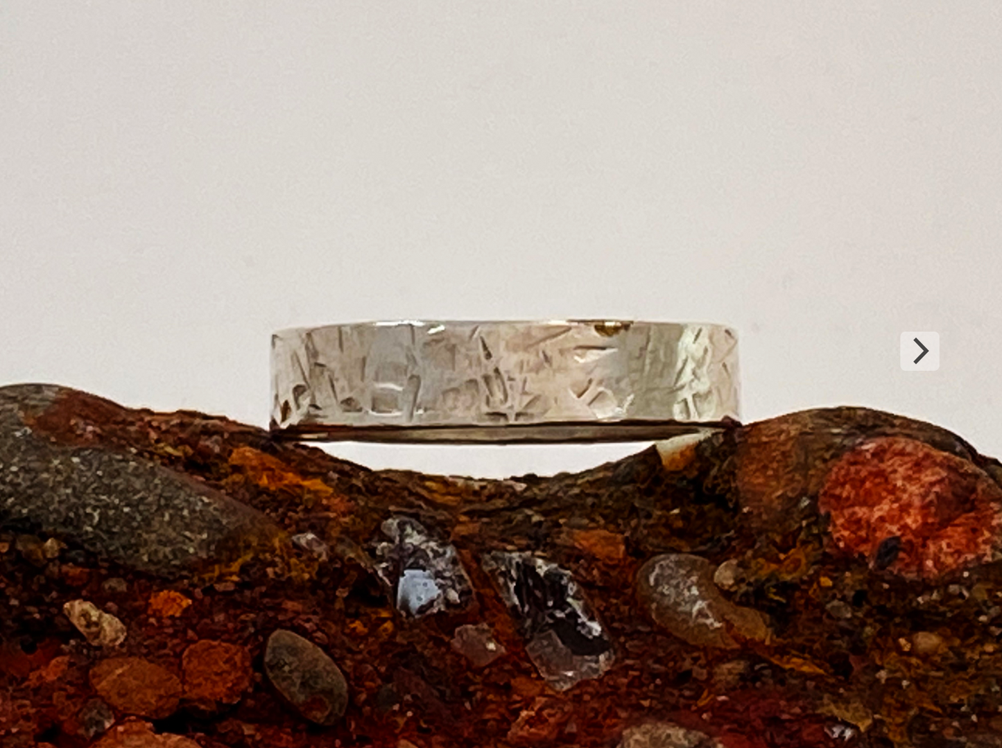 One-of-a-kind hand-crafted ring.  Unique Sterling Silver band is adorned with random stamp patterns Ring size 11-1/2 Style: rustic, boho, funky, organic, earthy yet elegant
