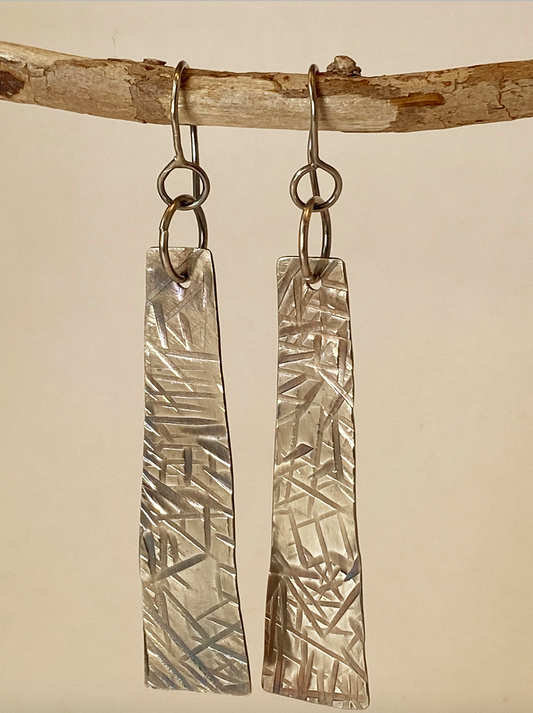 One-of-a-kind hand-crafted earrings.  Evocative long sterling silver tablet-shaped earrings. Hand-stamped embellishments. A flattering shape for almost any face. Stellae are 2" long x 1/2" wide. Handmade ear hook and ring add length.  Style: rustic, boho, elemental, earthy yet elegant