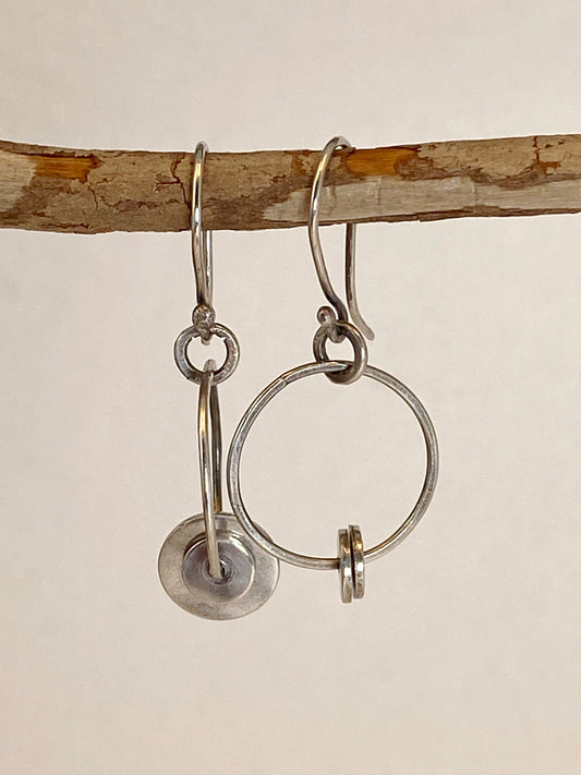 One-of-a-kind hand-crafted hoop earrings with sterling disks and handmade ear wire.  Style: rustic, boho, elemental, earthy yet elegant